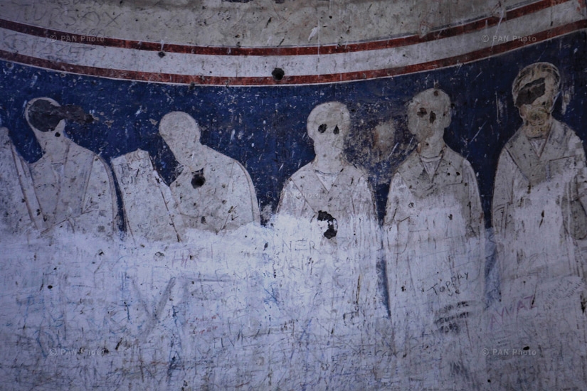 Icons on the walls of the ruined churches of Ani. Unidentified vandals have disfigured the eyes of the depicted saints