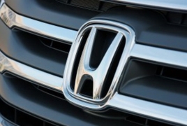 Honda profit falls on air bag recall