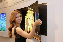 LG unveils a super-thin OLED TV that attaches to the wall with magnets