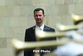 Assad says army forced to give up some areas to others