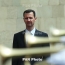Assad says army forced to give up some areas to others