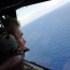 Malaysia calls for wider search for missing plane possible debris