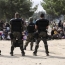 Macedonian police fire stun grenades to disperse thousands of migrants