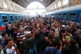 Hundreds of angry migrants rally outside Budapest train station
