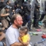 Hungary detains 29 as riot police use tear gas against migrants