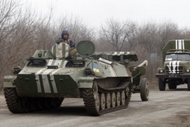 Ukraine, pro-Russian rebels start withdrawing weapons