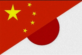 Japan, China agree to promote dialogue despite Nanjing dispute