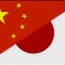 Japan, China agree to promote dialogue despite Nanjing dispute