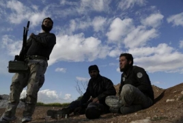 Syrian rebels capture town in country's west, seek to seize more
