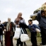 Fighters, civilians escape besieged Syrian areas under UN deal