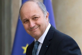 French FM calls for new push to fight global warming