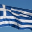 Greek central bank chief wants prompt conclusion to bailout review