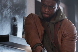 1st look at Chadwick Boseman in “Message From the King” action
