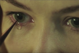 Rosamund Pike stars in Massive Attack's new vid “Voodoo”