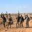 Syria government troops retake strategic road from IS fighters
