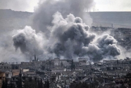 Airstrikes on IS-held Syrian city kill, wound dozens