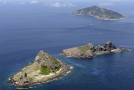 China lands military aircraft on disputed South China Sea island