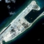 U.S. warship sails close to disputed South China Sea reef