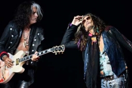 Aerosmith guitarist Joe Perry rushed to hospital after collapsing on stage
