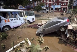 At least 75 people die, go missing in China flood