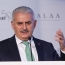 Turkey PM accepts Assad may play role in Syria transition