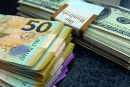 Azerbaijan halts or limits currency sales amid manat devaluation
