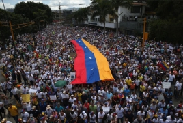 Venezuela govt. says foils coup after massive protest march