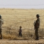 Турция обвиняет курдов в попытке помешать строительству стены на границе с Сирией