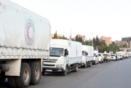 В четыре осажденных района Сирии доставлены около 70 грузовиков гумпомощи
