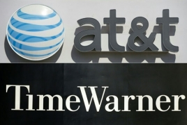 AT&T in advanced talks to acquire Time Warner, source says