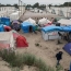 В Париже началась ликвидация стихийного лагеря мигрантов
