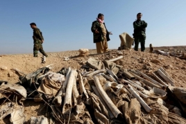 Iraqi experts investigating mass grave site found near Mosul