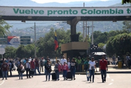 Venezuela reopens border crossings with Colombia, Brazil