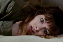 Anne Hathaway controls a monster in 