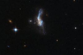 Astronomers find merging dwarf galaxies to back collision theory