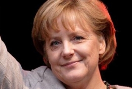 Merkel urges Putin to help end violence in eastern Ukraine