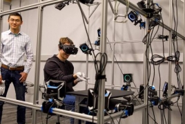 Facebook CEO Mark Zuckerberg tries out experimental VR gloves