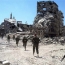 Syria talks challenged as over 80 killed in suicide blasts