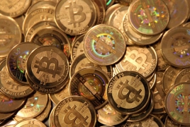 Bitcoin hits record high above $1,200