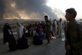 Iraqi forces secure key Mosul bridge as thousands of civilians flee