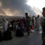 Iraqi forces secure key Mosul bridge as thousands of civilians flee