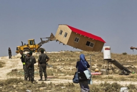 Israel begins evacuating West Bank settler homes