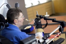 Quadriplegic man regains use of arm in medical first