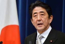 Japan's Abe says wants to resolve territorial row with Russia