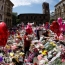 UK lowers security threat level as police close on bomber's network