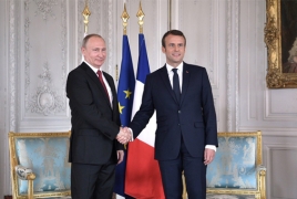 France's Macron hits out at Russian media after Putin talks