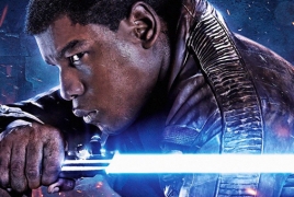 John Boyega shows Finn's new weapon in “Star Wars: The Last Jedi”