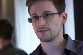 Putin says Snowden was wrong to leak U.S. spy secrets, but is no traitor