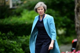 UK's May apologises to own MPs for election 'mess'