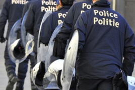 Brussels police arrest four, find arms cache